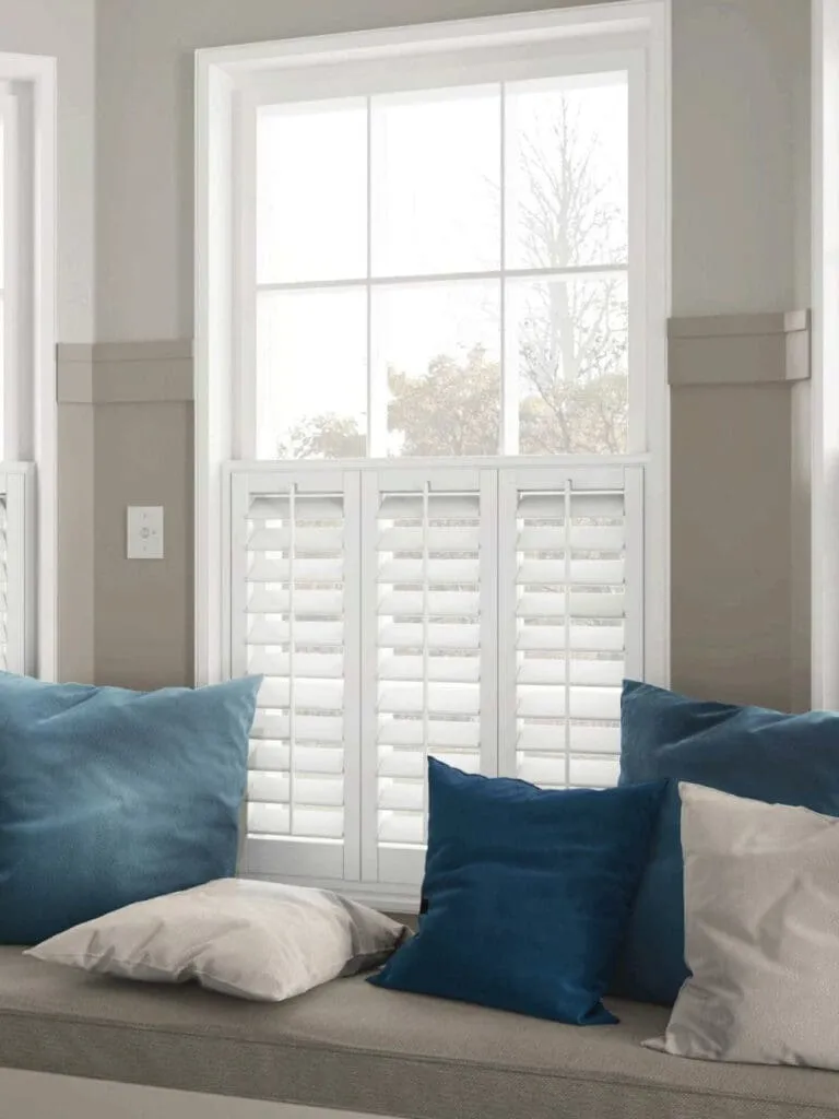 Made-to-measure white shutters fitted in a Norfolk living room